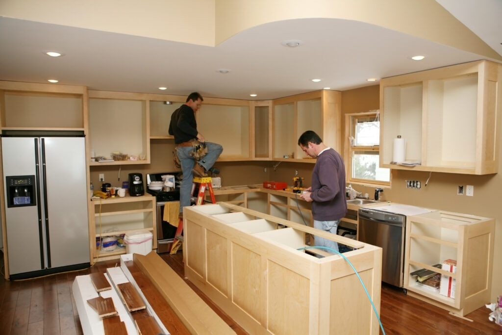 A client receiving kitchen repair services from experts.