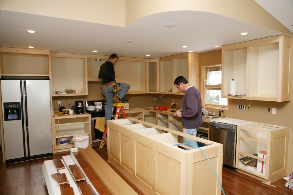 Experienced technician offering miscellaneous installation services to a client.
