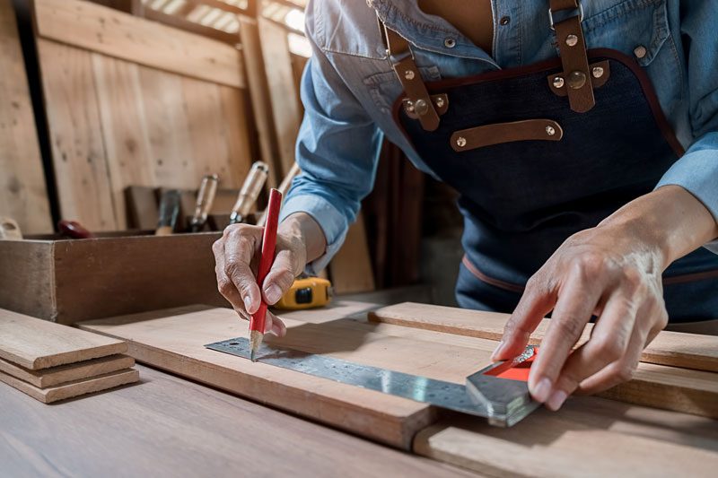 A person working on carpentry services for an Oxnard home.